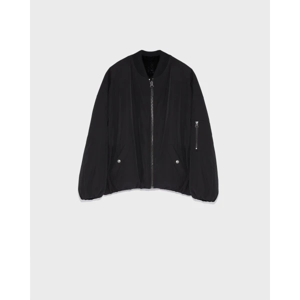 Woman wearing Yves Salomon shearling fur coat – luxury outerwear at Luxury Shoes 