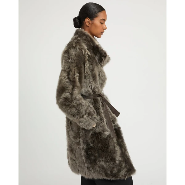 Woman wearing Yves Salomon shearling fur coat – luxury outerwear at Luxury Shoes 