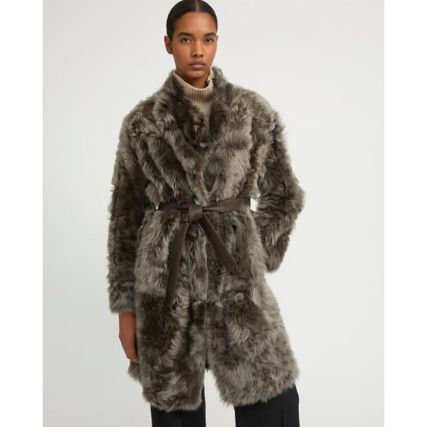 Woman wearing Yves Salomon shearling fur coat – luxury outerwear at Luxury Shoes 