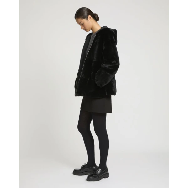 Woman wearing Yves Salomon shearling fur coat – luxury outerwear at Luxury Shoes 