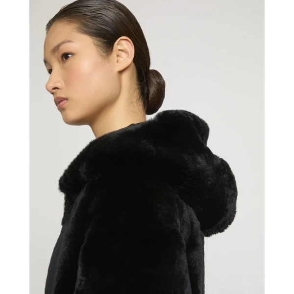 Woman wearing Yves Salomon shearling fur coat – luxury outerwear at Luxury Shoes 