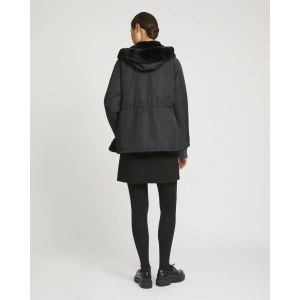 Woman wearing Yves Salomon shearling fur coat – luxury outerwear at Luxury Shoes 
