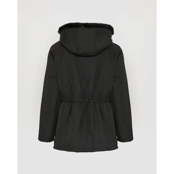 Woman wearing Yves Salomon shearling fur coat – luxury outerwear at Luxury Shoes 