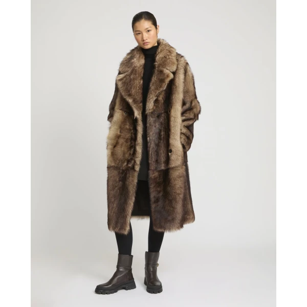 Woman wearing Yves Salomon shearling fur coat – luxury outerwear at Luxury Shoes 