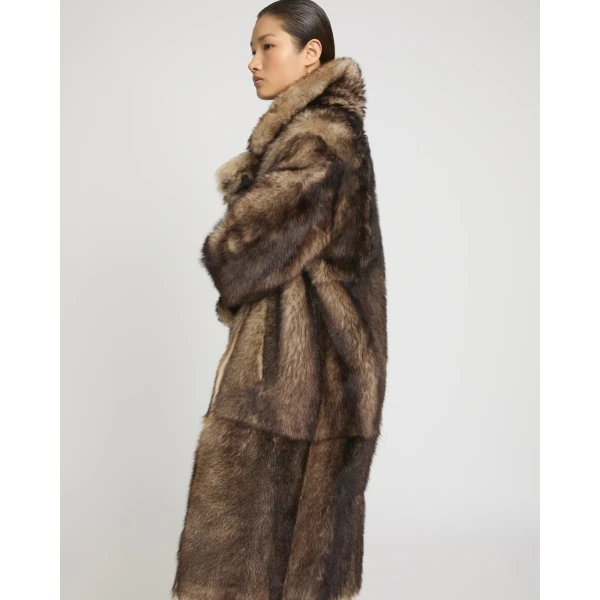 Woman wearing Yves Salomon shearling fur coat – luxury outerwear at Luxury Shoes 