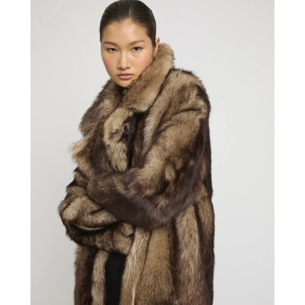 Woman wearing Yves Salomon shearling fur coat – luxury outerwear at Luxury Shoes 