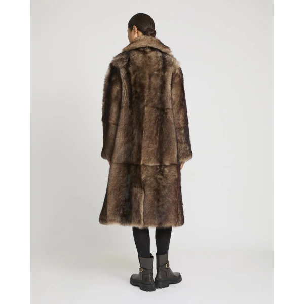 Woman wearing Yves Salomon shearling fur coat – luxury outerwear at Luxury Shoes 