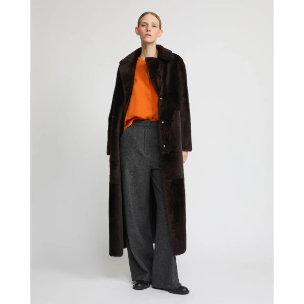 Woman wearing Yves Salomon shearling fur coat – luxury outerwear at Luxury Shoes 