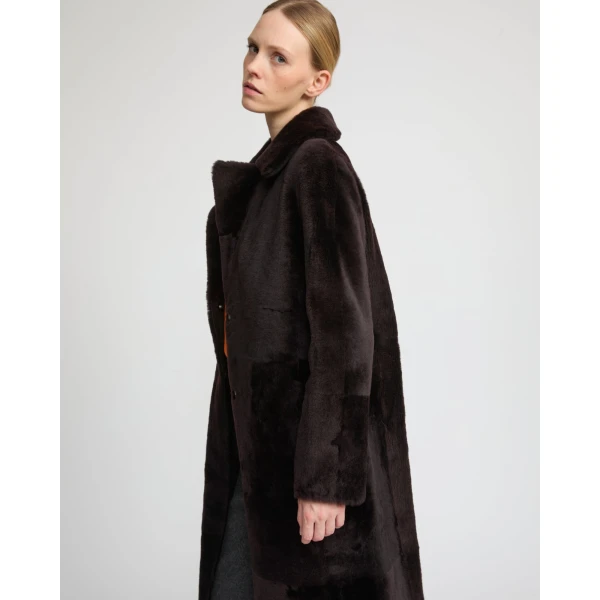 Woman wearing Yves Salomon shearling fur coat – luxury outerwear at Luxury Shoes 