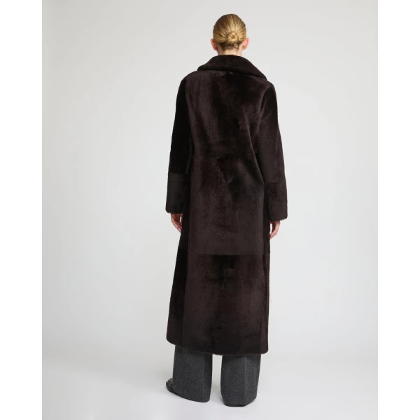 Woman wearing Yves Salomon shearling fur coat – luxury outerwear at Luxury Shoes 