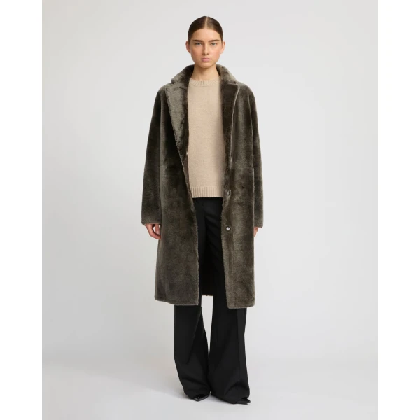 Woman wearing Yves Salomon shearling fur coat – luxury outerwear at Luxury Shoes 