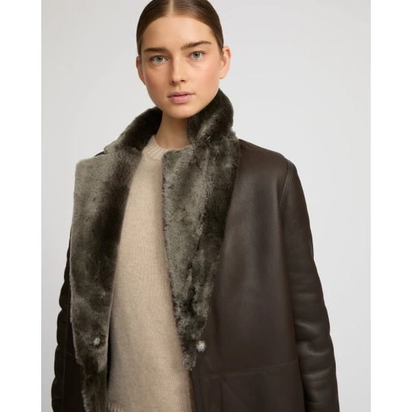 Woman wearing Yves Salomon shearling fur coat – luxury outerwear at Luxury Shoes 