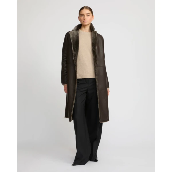Woman wearing Yves Salomon shearling fur coat – luxury outerwear at Luxury Shoes 
