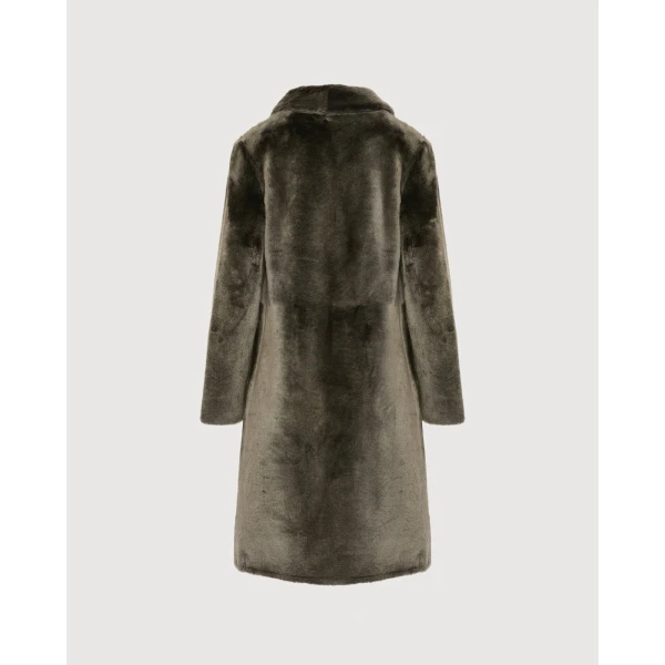 Woman wearing Yves Salomon shearling fur coat – luxury outerwear at Luxury Shoes 