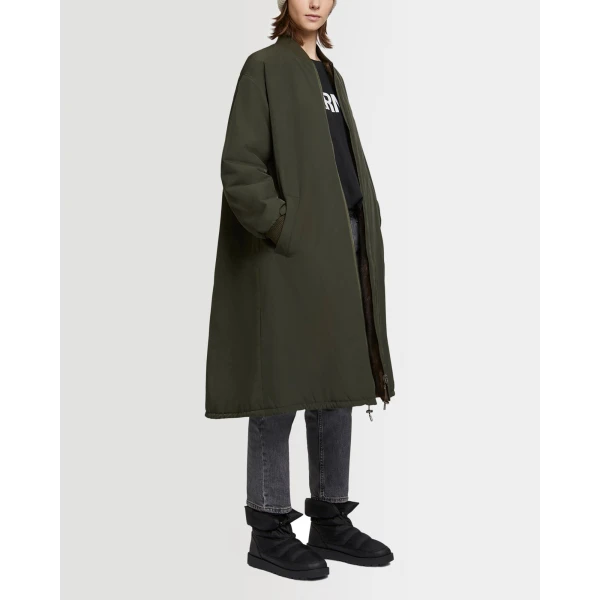 Woman wearing Yves Salomon shearling fur coat – luxury outerwear at Luxury Shoes 