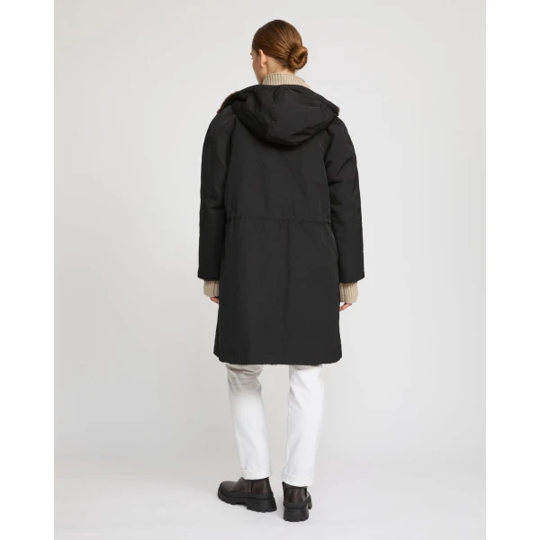 Woman wearing Yves Salomon shearling fur coat – luxury outerwear at Luxury Shoes 