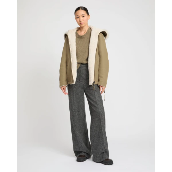 Woman wearing Yves Salomon shearling fur coat – luxury outerwear at Luxury Shoes 