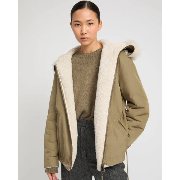 Woman wearing Yves Salomon shearling fur coat – luxury outerwear at Luxury Shoes 