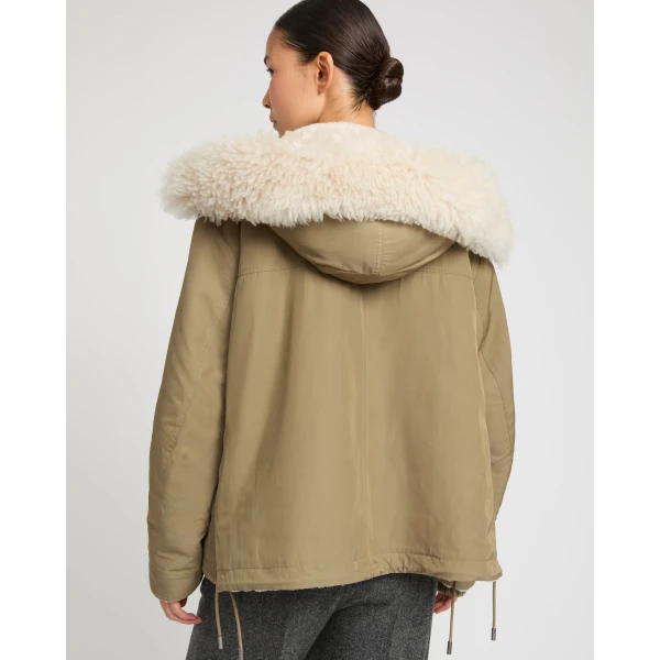 Woman wearing Yves Salomon shearling fur coat – luxury outerwear at Luxury Shoes 