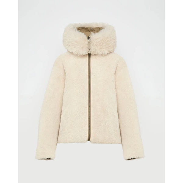 Woman wearing Yves Salomon shearling fur coat – luxury outerwear at Luxury Shoes 
