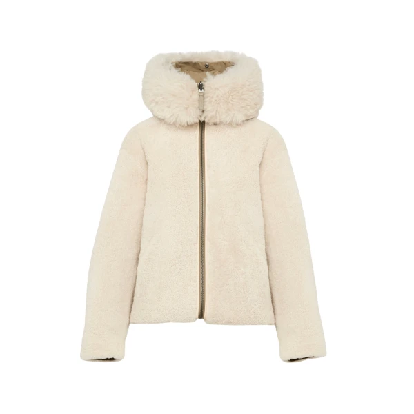 Woman wearing Yves Salomon shearling fur coat – luxury outerwear at Luxury Shoes 