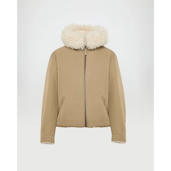 Woman wearing Yves Salomon shearling fur coat – luxury outerwear at Luxury Shoes 