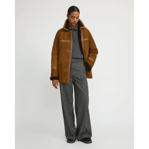 Woman wearing Yves Salomon shearling fur coat – luxury outerwear at Luxury Shoes 