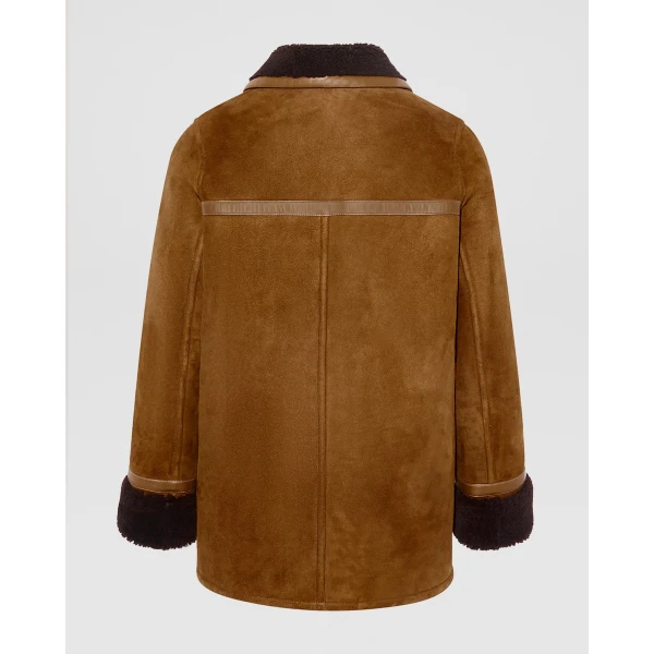 Woman wearing Yves Salomon shearling fur coat – luxury outerwear at Luxury Shoes 