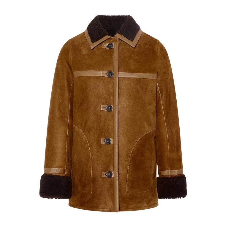 Woman wearing Yves Salomon shearling fur coat – luxury outerwear at Luxury Shoes 