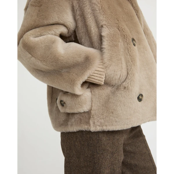 Woman wearing Yves Salomon shearling fur coat – luxury outerwear at Luxury Shoes 