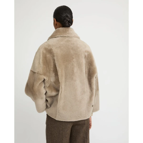 Woman wearing Yves Salomon shearling fur coat – luxury outerwear at Luxury Shoes 