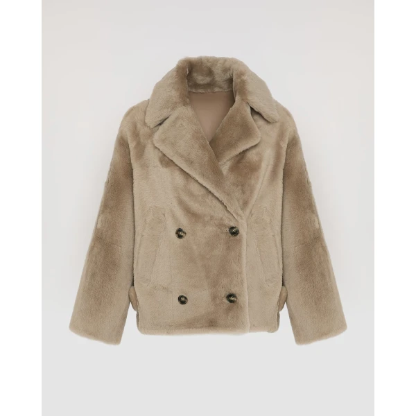 Woman wearing Yves Salomon shearling fur coat – luxury outerwear at Luxury Shoes 