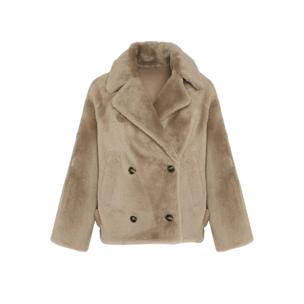 Woman wearing Yves Salomon shearling fur coat – luxury outerwear at Luxury Shoes 