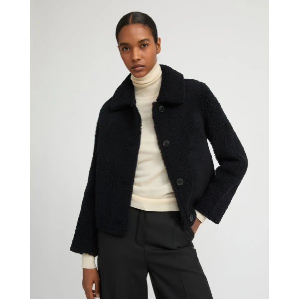 Woman wearing Yves Salomon shearling fur coat – luxury outerwear at Luxury Shoes 