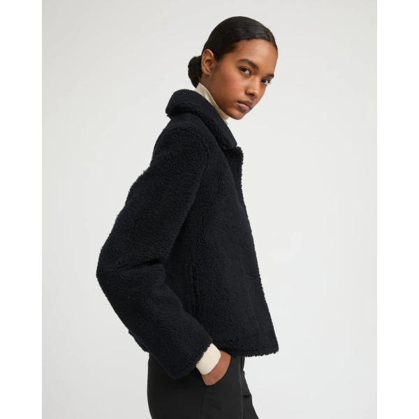 Woman wearing Yves Salomon shearling fur coat – luxury outerwear at Luxury Shoes 