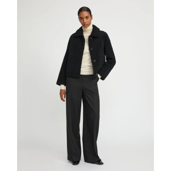 Woman wearing Yves Salomon shearling fur coat – luxury outerwear at Luxury Shoes 