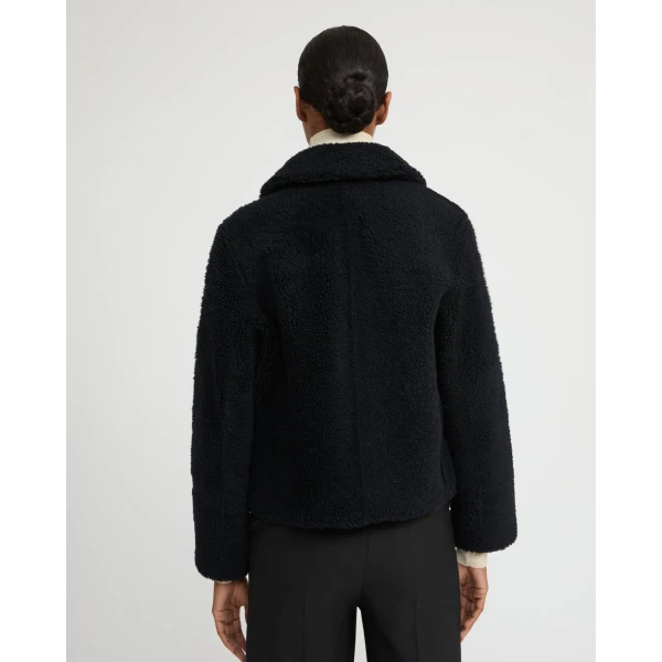 Woman wearing Yves Salomon shearling fur coat – luxury outerwear at Luxury Shoes 