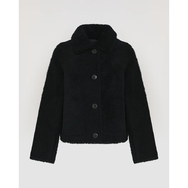Woman wearing Yves Salomon shearling fur coat – luxury outerwear at Luxury Shoes 