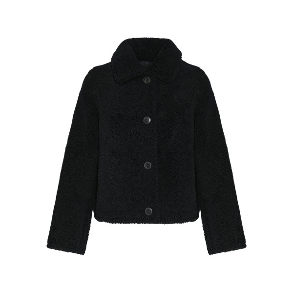 Woman wearing Yves Salomon shearling fur coat – luxury outerwear at Luxury Shoes 