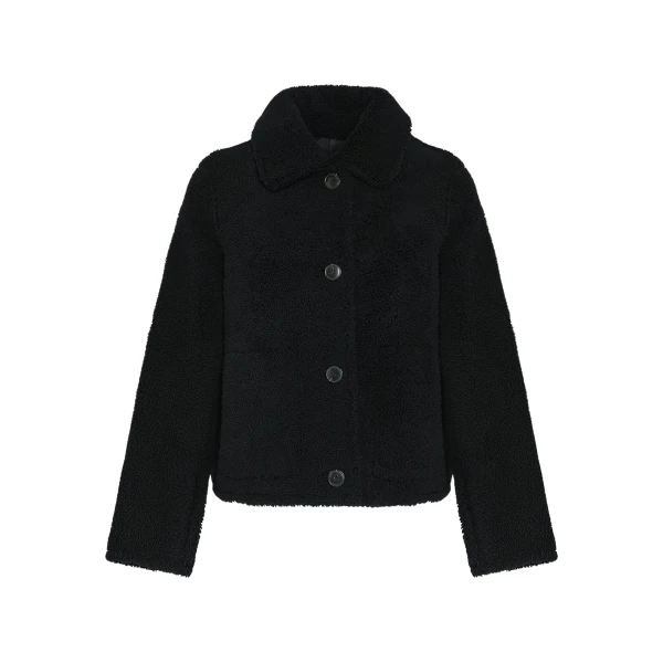 Woman wearing Yves Salomon shearling fur coat – luxury outerwear at Luxury Shoes 