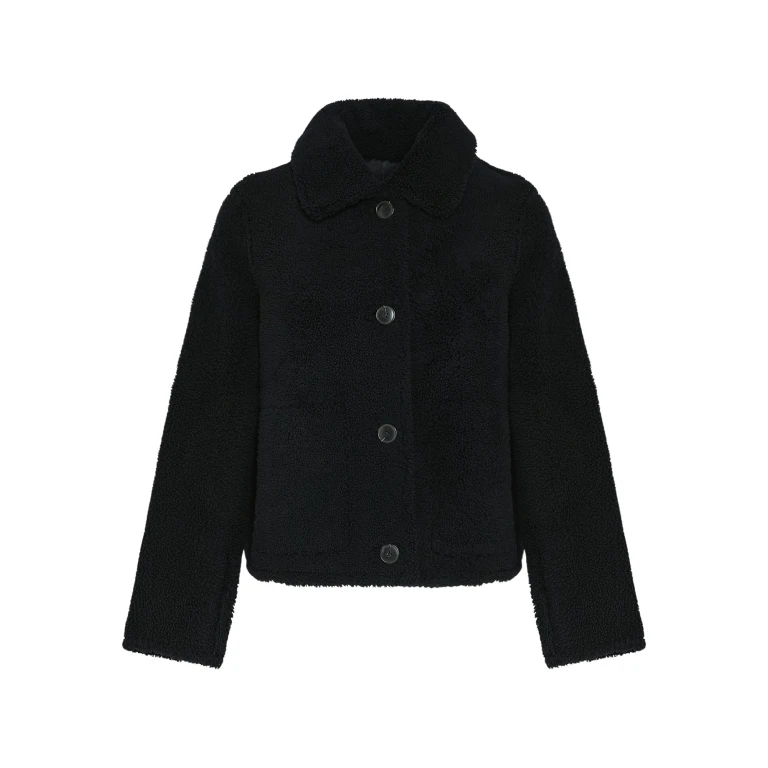 Woman wearing Yves Salomon shearling fur coat – luxury outerwear at Luxury Shoes 