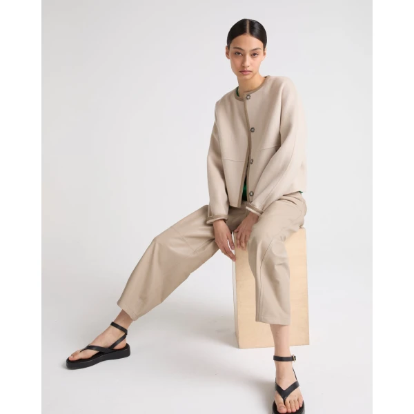 Woman wearing Yves Salomon shearling fur coat – luxury outerwear at Luxury Shoes 