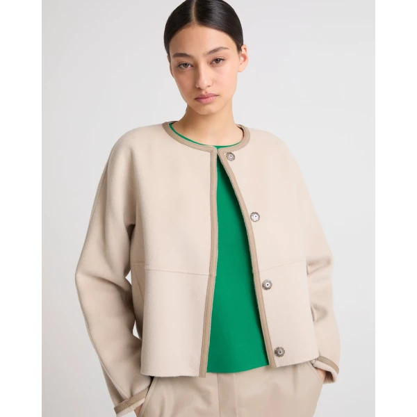 Woman wearing Yves Salomon shearling fur coat – luxury outerwear at Luxury Shoes 