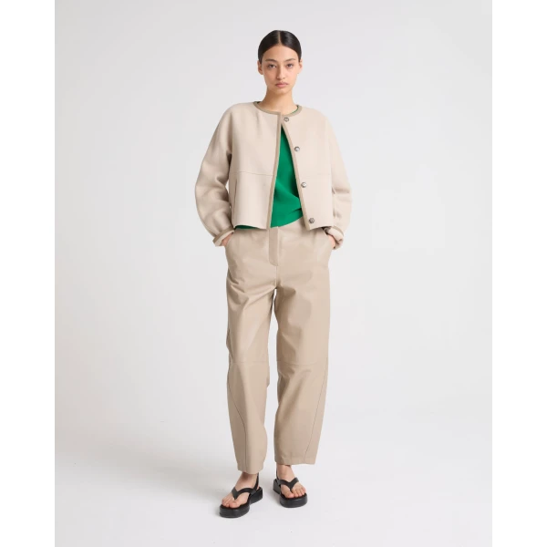 Woman wearing Yves Salomon shearling fur coat – luxury outerwear at Luxury Shoes 