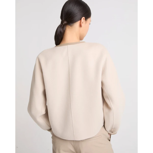 Woman wearing Yves Salomon shearling fur coat – luxury outerwear at Luxury Shoes 
