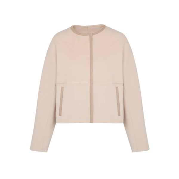 Woman wearing Yves Salomon shearling fur coat – luxury outerwear at Luxury Shoes 
