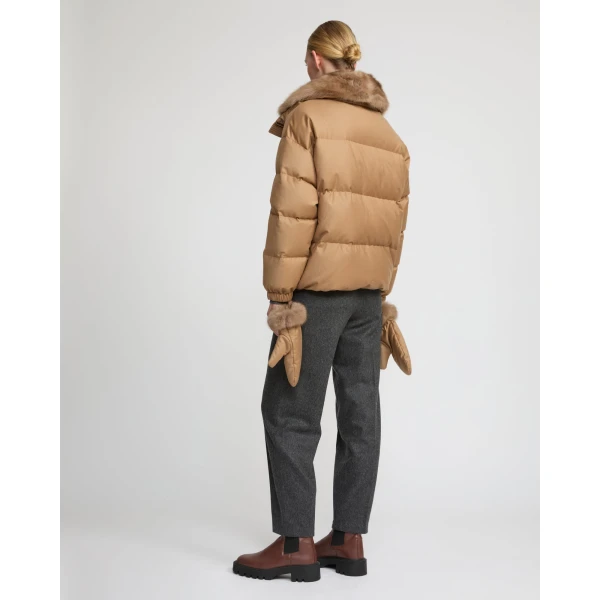 Woman wearing Yves Salomon shearling fur coat – luxury outerwear at Luxury Shoes 