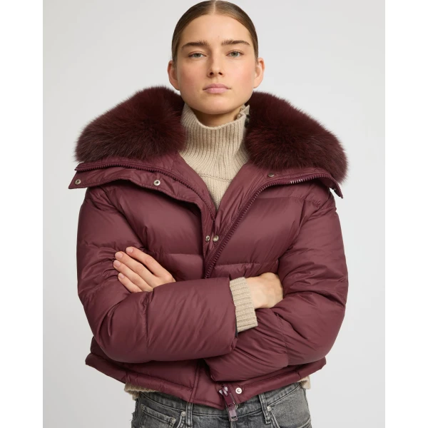 Woman wearing Yves Salomon shearling fur coat – luxury outerwear at Luxury Shoes 