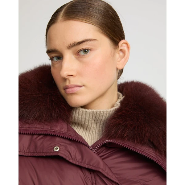 Woman wearing Yves Salomon shearling fur coat – luxury outerwear at Luxury Shoes 