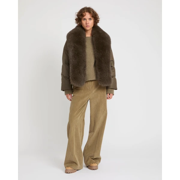Woman wearing Yves Salomon shearling fur coat – luxury outerwear at Luxury Shoes 